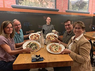 Uno Venti customers enjoying their individual pizzas